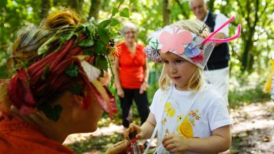 Little girl in nature with grandparents